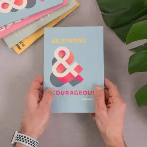 A5 notebook. Be strong and courageous. Lined pages.